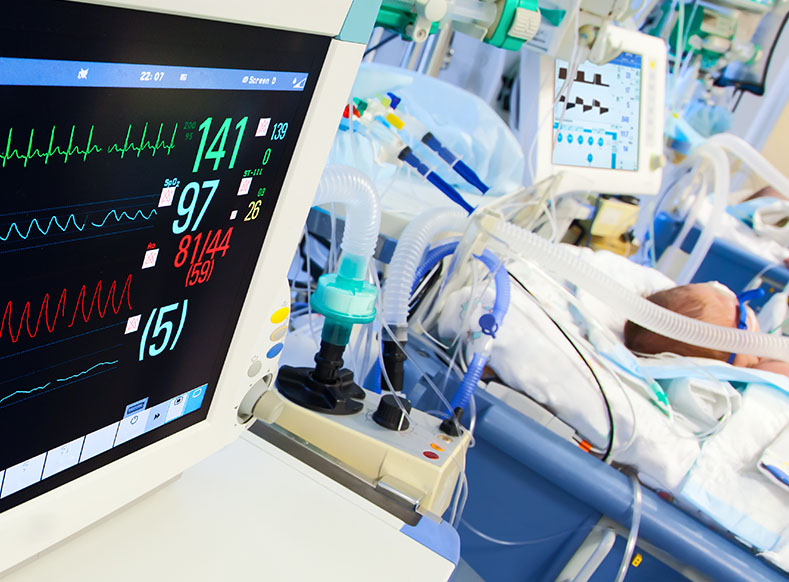 Neonatal ICU with ECG monitor on foreground Neonatal ICU with ECG monitor on foreground